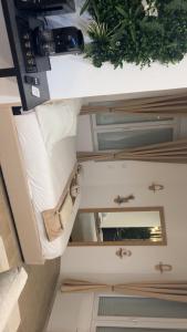a room with a table with a mirror on it at Jardin eden88 in Saint Die +1 photo