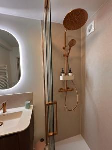 a bathroom with a shower and a sink at Residentie Hippocampe in Wenduine +24 photos