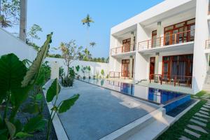 an external view of a house with a swimming pool at KIRI's HEAVEN in Ahangama +30 photos