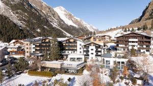 an aerial view of a resort in the mountains at Verwöhnhotel Wildspitze in Sankt Leonhard im Pitztal