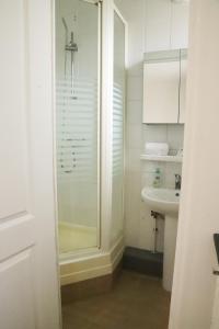 a bathroom with a shower and a sink at Hôtel & Restaurant ISVARA in Breteuil +49 photos