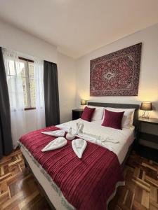a bedroom with a large bed with towels on it at Ocean View Guest House in São Vicente