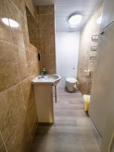 a bathroom with a sink and a toilet at Allison House 17 in Edinburgh +37 photos