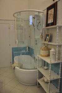 a bathroom with a shower and a tub and a sink at Alloggio turistico a Ravenna in Ravenna +28 photos