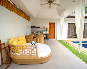 a living room with a couch and a table at Bali Villas Panglao Bohol in Panglao Island