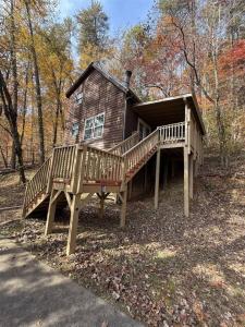 a large wooden house with a large deck at Bavarian Hideaway 46 in Sautee Nacoochee
