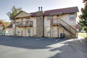 a building with a parking lot in front of it at Bavarian Brook Condo 15 in Helen