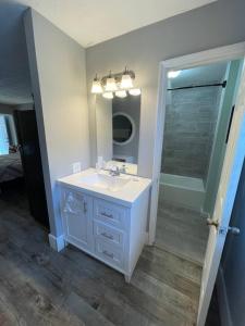 a bathroom with a white sink and a mirror at Bavarian Brook Unit 8 in Helen