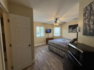 a bedroom with a bed and a ceiling fan at Rivers Edge 703A in Helen +2 photos