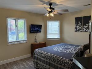 a bedroom with a bed and a ceiling fan at Rivers Edge 703A in Helen