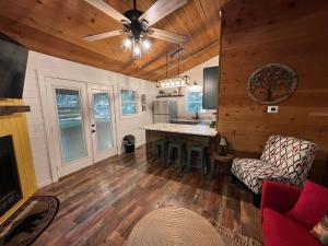 a kitchen with a table and a ceiling fan at Bavarian Hideaway 25 in Helen