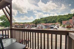 a balcony with a view of a town at Rivers Edge 803A in Helen