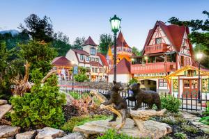 a statue of two bears in a garden in front of a house at Bavarian Brook Unit 7 in Helen