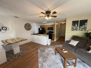 a living room with a couch and a table at Rivers Edge 802 in Helen