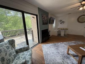 a living room with a couch and a table at Rivers Edge 802 in Helen