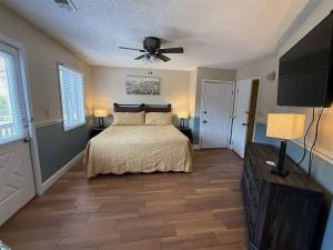a bedroom with a bed and a ceiling fan at Rivers Edge 802 in Helen