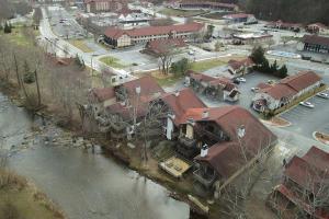 an aerial view of a town with houses and a river at Bavarian Brook Unit 9a in Helen