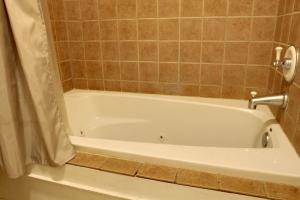 a white bath tub in a bathroom at Bavarian Brook Condo 11 in Helen