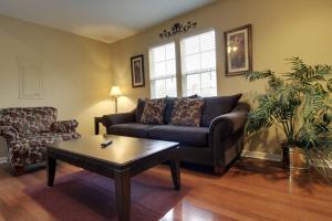 a living room with a couch and a coffee table at Bavarian Brook Condo 11 in Helen