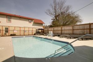 a swimming pool in front of a house with a fence at Bavarian Brook Unit 6A in Helen