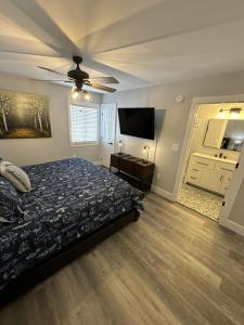 a bedroom with a bed and a ceiling fan at Rivers Edge 703c in Helen