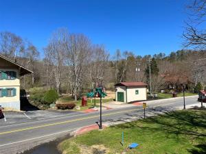 an empty street with a playground on the side of a road at Bavarian Brook Condo 14 in Helen