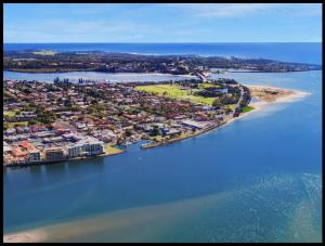 an aerial view of an island in a body of water at Water Front Retreat Ballina in Ballina +1 photo