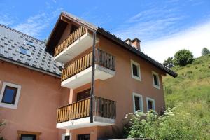 a building with balconies on the side of it at Les faons in Roubion