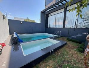 a swimming pool in the backyard of a house at Residencia con alberca in Las Ánimas