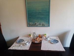a table with two plates of food on it at Affitta camere Explora caffè in Trieste