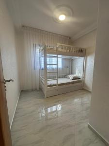 a bedroom with two bunk beds in a room at Al Hoceima Mini Villa in Al Hoceïma