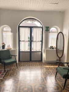 a room with an arched door and a mirror at Ethno House Andrej in Korbovo +24 photos