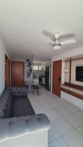 a living room with a couch and a table at Brisas do Lago II in Paulo Afonso