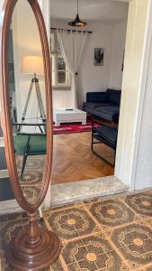 a mirror sitting on a floor in a living room at Ethno House Andrej in Korbovo