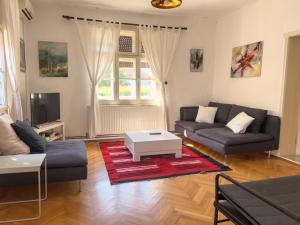 a living room with a couch and a coffee table at Ethno House Andrej in Korbovo
