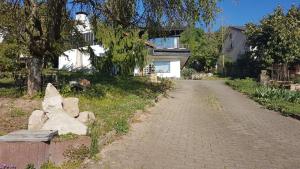 a stone bench sitting on the side of a road at Ferienwohnung Vogelsang in Sachsenheim