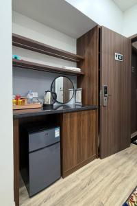 a kitchen with a dishwasher and a mirror at Phoenix home in Phù Ninh