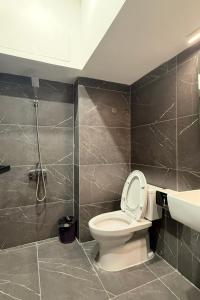 a bathroom with a toilet and a sink at Phoenix home in Phù Ninh