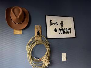 a hat and a rope and a cowboy hat on a wall at New Studio- 2 beds 7 mins to DT in Nashville
