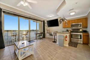 a kitchen and living room with a view of the ocean at Sunsets Waterview Balcony King Bed & Heated Pool in St. Petersburg +10 photos