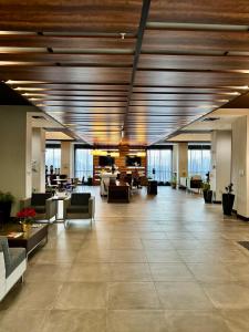 a lobby with couches and tables in a building at Wingate by Wyndham Kamloops in Kamloops +87 photos