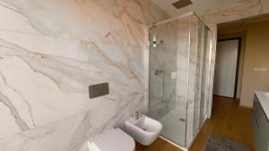 a bathroom with a sink and a toilet and a shower at NB Luxury Attico Vista Mare in Sanremo +20 photos