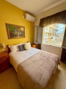 En eller flere senge i et værelse på Horizon Apartments Gozo