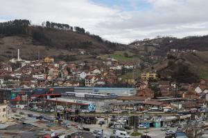 a city with a bunch of buildings on a hill at D&A Apartments in Novi Pazar