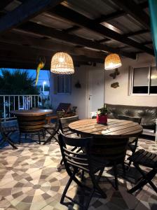 a dining room with a table and chairs and lights at Los Aromos in Federación