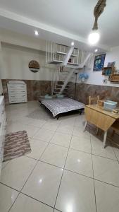 a large living room with a staircase and a table at Casa Della Felicità in Naples +19 photos