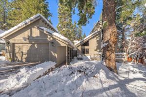a house with a garage in the snow at Dollar Point - Observation Dr, home in Tahoe City