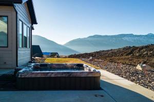 a large tub sitting on the side of a house at Powder Mtn Chalet B4 Ski Escape Hot Tub & View in Eden