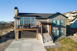 a large house with an open door and a patio at Powder Mtn Chalet B4 Ski Escape Hot Tub & View in Eden +37 photos