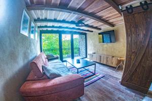 a living room with a couch and a table at Chata Geruša in Čebovce